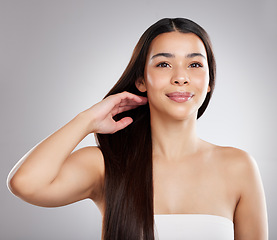 Image showing Woman, hair care and beauty with hairstyle and shine, portrait and growth isolated on studio background. Female model with smile, keratin treatment and cosmetic care with texture and glossy