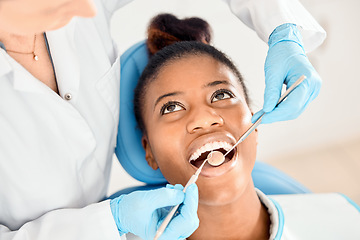 Image showing Dentist, black woman and mouth cleaning of patient at a clinic with medical and healthcare for teeth. Mirror, orthodontist and African female person with wellness and dental work tool with care