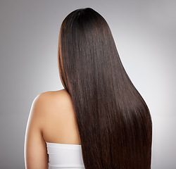 Image showing Hair, back and woman with beauty and salon hairstyle, cosmetic care and elegance isolated on studio background. Female model with growth, shine and texture with Brazilian or keratin treatment