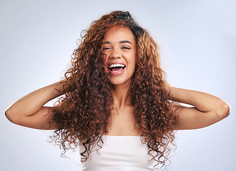 Image showing Woman, natural hair and curly hairstyle in studio with smile and face glow. Portrait of African person with healthy curls and growth as benefits or results of shampoo or cosmetics on white background