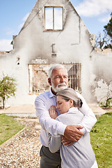 Image showing Couple, home in ruins after fire and hug at accident, disaster or crisis with hope and support with insurance. Property, senior man and woman hugging outside burned house, grief and real estate loss