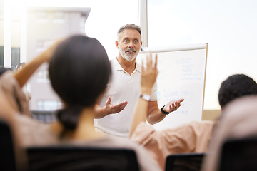 Image showing Group, speaker and man in a workshop, presentation and questions for feedback, meeting and review. Male person, mentor and staff in a conference room, teamwork and sales growth with collaboration