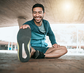 Image showing Man, stretching and foot for workout and fitness in the outdoor for wellness in the city. Male athlete, stretch and legs while sitting for training and exercise for sports competition in parking.