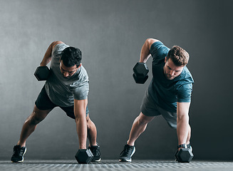 Image showing Fitness, men and dumbbell push up for exercise with focus, power and strong muscle with a grey background. Friends or people at gym together for a workout, training commitment or bodybuilder goals