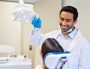 Image showing Dentist, man and patient in chair for dental service, healthcare exam or medical insurance in consultation office. Happy asian person or doctor for woman teeth whitening, oral or cleaning in clinic