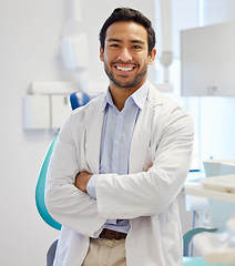 Image showing Dentist, portrait and man with arms crossed for healthcare service, dental hospital or insurance in consultation office. Happy asian person or doctor with teeth, oral or hygiene health in clinic