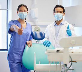 Image showing Dentist team, face mask and thumbs up portrait for.medical industry and teamwork. Assistant woman and asian man or healthcare staff together for dental care, oral health and wellness at practice