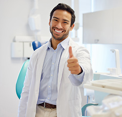 Image showing Portrait, man and dentist with thumbs up, smile and oral care with happiness, specialist and professional. Face, male person or employee with dental hygiene, healthcare sector and support with review