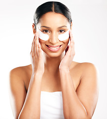 Image showing Happy woman, portrait and eye patches for skincare, beauty or cosmetics against a white studio background. Face of female person with facial collagen pads under eyes for anti aging or dermatology