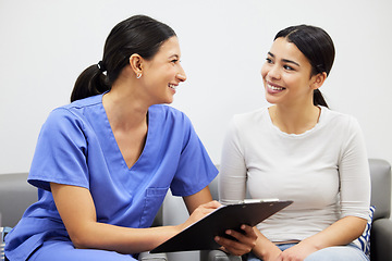 Image showing Clipboard, nurse and woman advice in clinic office, healthcare service and talking, question or consultation. Consulting, checklist and doctor, women or happy people, medical help or insurance survey