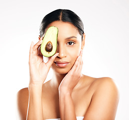 Image showing Woman, portrait and avocado in natural skincare, beauty or nutrition against a white studio background. Face of female person or model with organic fruit or vegetable for healthy skin, diet or facial