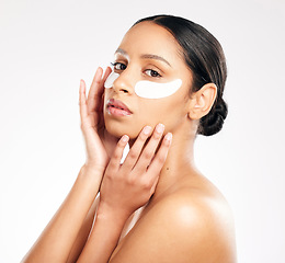 Image showing Woman, portrait and eye mask in skincare, cosmetics or beauty against a white studio background. Face of female person or model with facial collagen pads under eyes for anti aging or dermatology