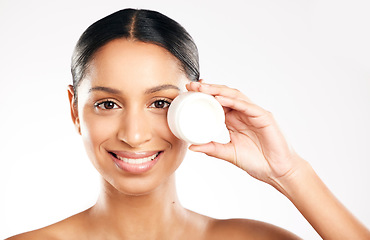 Image showing Happy woman, portrait and face cream for skincare, cosmetics or beauty against a white studio background. Female person with container, product or lotion and smile for dermatology or facial treatment