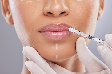 Image showing Closeup, lip filler and botox with woman and injection for plastic surgery, dermatology and beauty. Pattern, aesthetic and medical with model and syringe on grey background for collagen and cosmetics