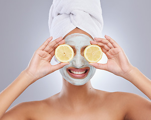 Image showing Mask, beauty and lemon with woman in studio for skincare, natural cosmetics and vitamin c. Self care, glow and spa with face of female model and citrus fruit on grey background for detox product