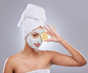 Image showing Mask, skincare and lemon with portrait of woman in studio for beauty, natural cosmetics and vitamin c. Self care, glow and spa with female model and citrus fruit on grey background for detox product