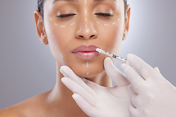 Image showing Plastic surgery, aesthetic and lip filler with woman and injection for botox, dermatology and beauty. Pattern, change and medical with model and syringe on grey background for collagen and cosmetics