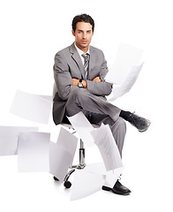 Image showing Portrait, arms crossed and business man with documents isolated on a transparent png background. Paperwork in air, serious and male professional on chair, confident person and calm during stress.