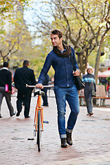 Image showing Getting around the green way. Full length shot of a handsome man in the city with his bicycle.