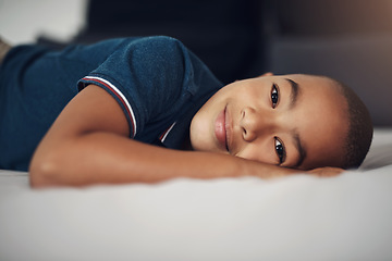 Image showing Being a kid is super tiring. Shot of an adorable little boy lying on his bed at home.