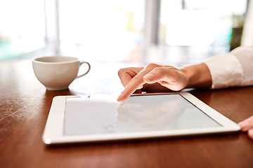 Image showing Be smart about the way you work. Closeup shot of an unrecognisable businesswoman using a digital tablet in an office.