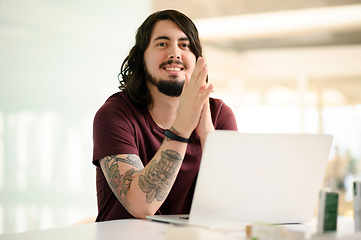 Image showing Hard work and dedication leads to a successful career. Portrait of a young businessman working on a laptop in an office.