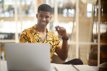 Image showing He develops so many amazing ideas all on his own. Shot of a young businessman working on a laptop in an office.