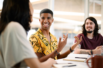 Image showing I knew youd love my idea. Shot of a young businessman having a discussion with his colleagues in an office.