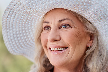 Image showing Happiness is permanent on her face. Cropped shot of an attractive senior woman smiling while standing outdoors on a summers day.