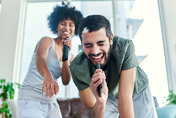 Image showing He knows that I always have his back. Cropped shot of a couple having a sing along at home.