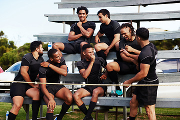 Image showing Action isnt just reserved for the field. Shot of a group of young men sitting on the benches together at a rugby game.