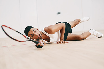 Image showing Nothing puts you through your paces like squash. Shot of a young man playing a game of squash.