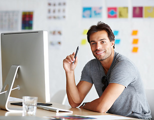 Image showing Computer, pen and portrait of man for creativity, ideas and planning for online career, graphic design and website. Creative, face happy person on desktop pc, startup business and workspace or office