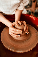 Image showing Creating things with my hands is what I love most. Cropped shot of an unrecognizable woman molding clay on a pottery wheel.