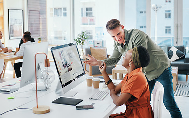 Image showing When great minds come together, so do great things. Cropped shot of two young business colleagues having a discussion and working on a computer together in the office.