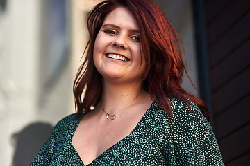 Image showing All you need in life is fabulous red hair. Cropped shot of a beautiful young woman posing outdoors.