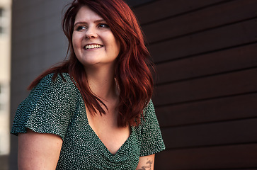 Image showing Red hair is like a crown you never take off. Cropped shot of a beautiful young woman posing outdoors.