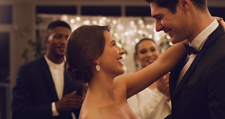 Image showing Im already loving being married to you. Cropped shot of an affectionate young newlywed couple dancing in front of their guests at their wedding reception.