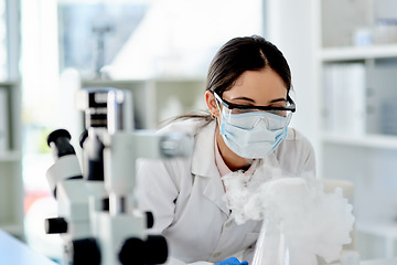 Image showing The world of science is so intriguing. Shot of a young scientist doing an experiment in a lab.