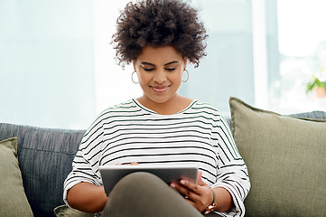 Image showing Its much more convenient to work wirelessly. Shot of a young businesswoman using a digital tablet in an office.