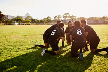 Image showing We have to win. Full length shot of a diverse group of sportsmen crouching together before playing rugby during the day.