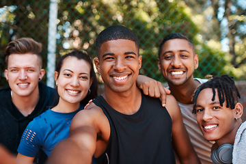 Image showing Staying active automatically makes you happier too. Portrait of a group of sporty young people taking selfies together outdoors.