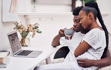 Image showing My test results should pop up anytime now...Shot of a young couple using a laptop while sitting together at home.