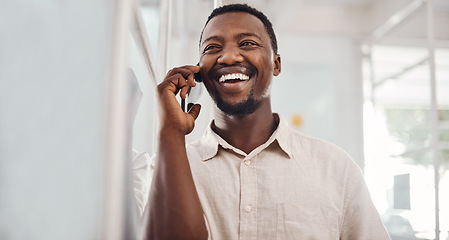 Image showing Yes, thats a deal. Shot of a young businessman talking on a cellphone in an office.