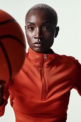 Image showing Prepare to feel intimidated. Studio shot of an attractive young woman playing basketball against a grey background.