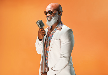 Image showing Lets jazz things up a little. Studio shot of a senior man wearing vintage clothes while singing into a microphone.