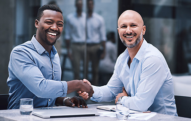 Image showing You never know where you connections could take you. Shot of two businessmen shaking hands during a meeting.