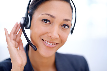 Image showing Ready for any customer queries. Close up shot of an attractive female employee wearing headphones.