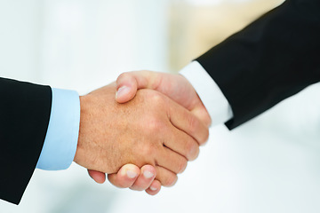 Image showing Down to business. Cropped shot of two businessmen shaking hands.