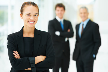 Image showing Making our way to the top. Portrait of a businesswoman with colleagues standing in the background.